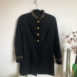 Bell boy style navy jacket w/ gold accents.